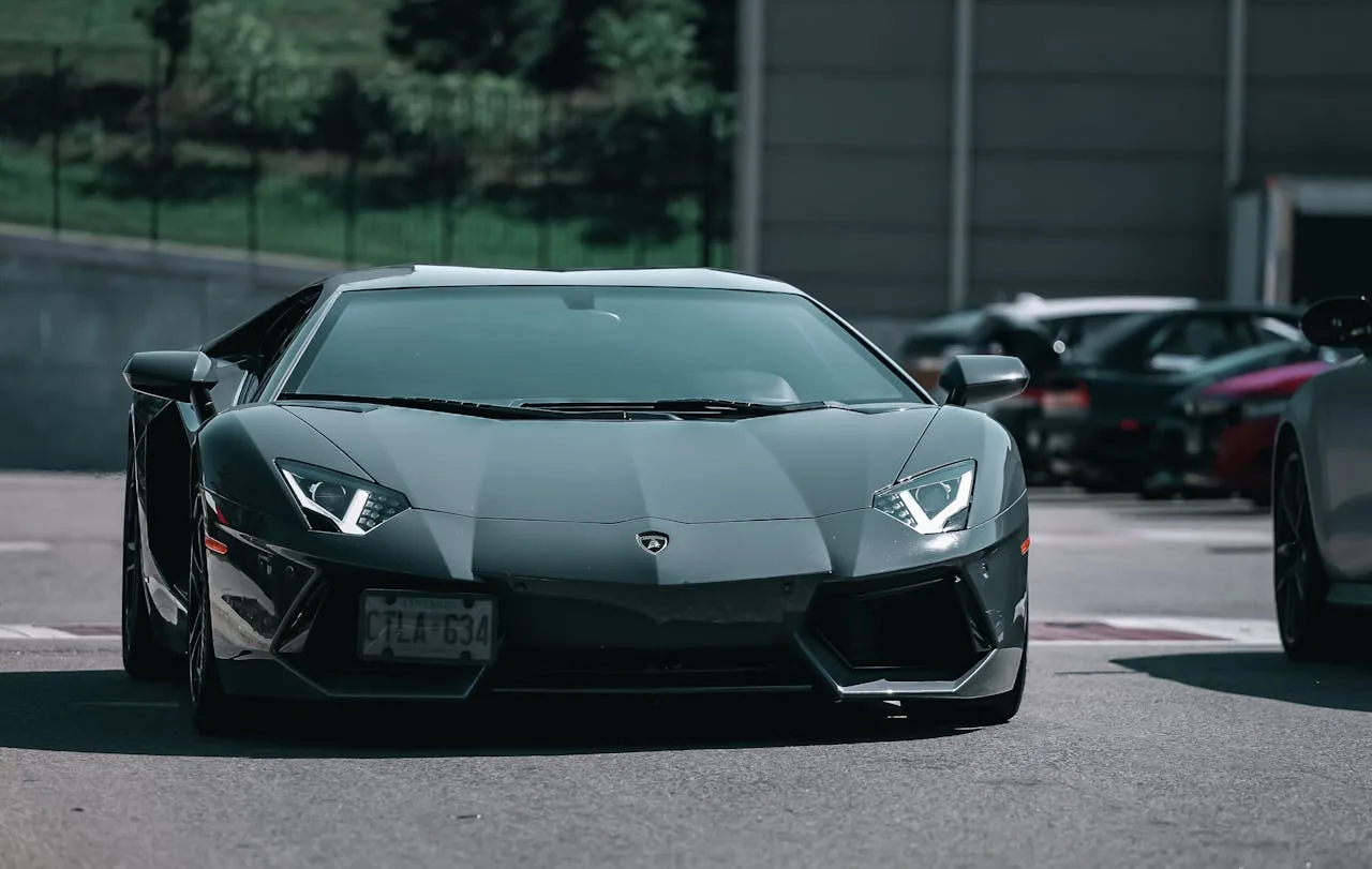 a black lamborghini on the road